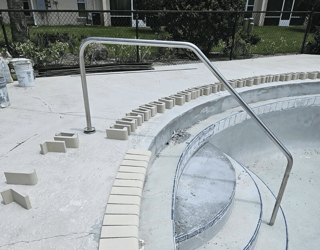 Residential pool drained and prepped for resurfacing and repair by Pools USA in Port St. Lucie, FL.